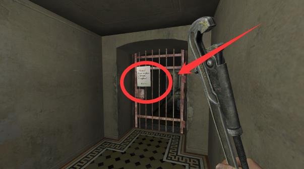 A note hanging on the metal gate to the right of the stairs in the Hospital level.